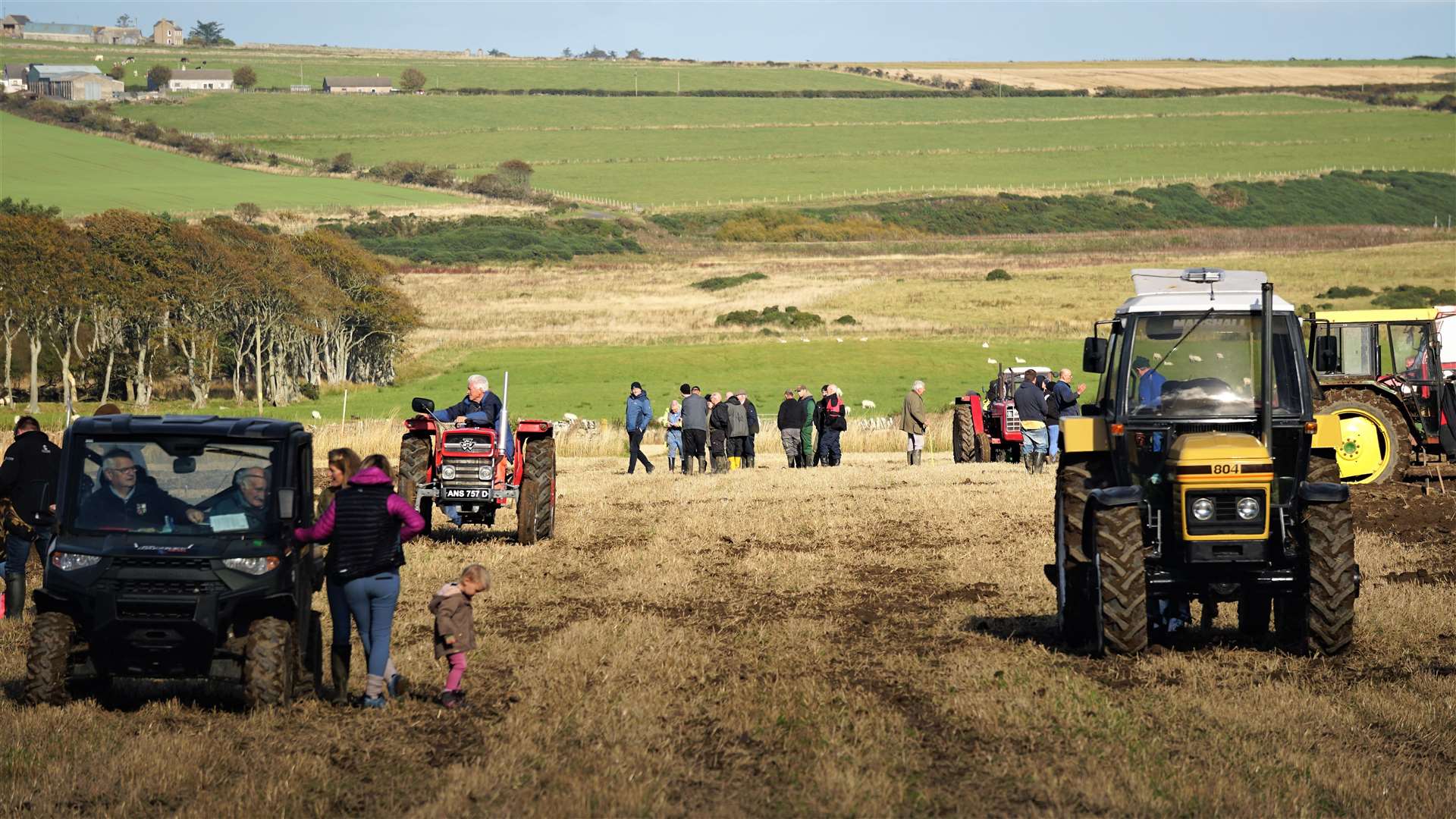 The tractors retire from the field after a busy day ploughing. Picture: DGS