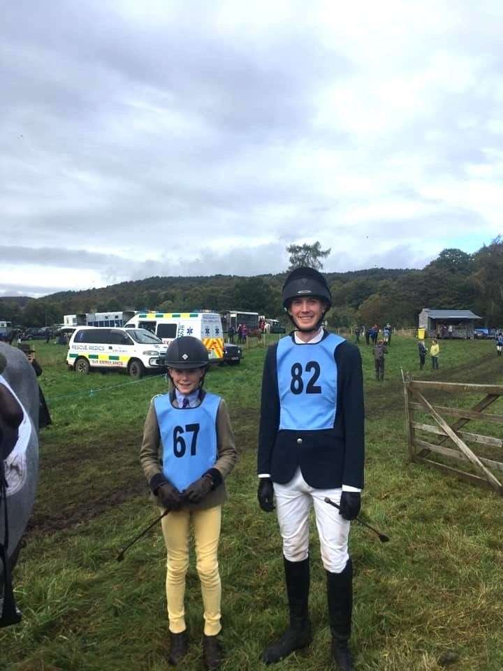 Liam Mackenzie (left) and Andreas Ramsøy take time out for a photo after walking the showjumping track. The muddy conditions at Scotsburn can be seen in the background.