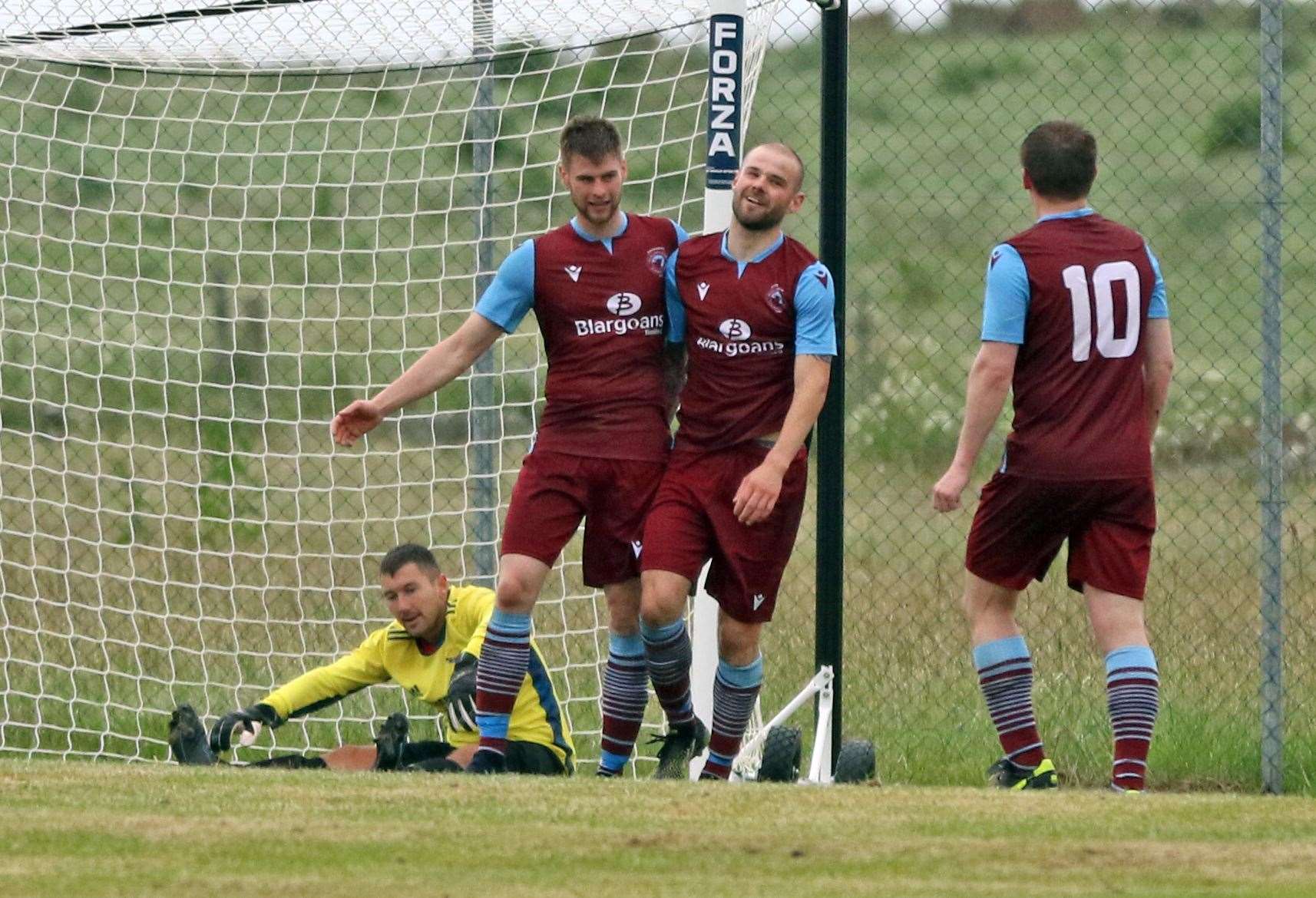 Sean Munro (centre) is congratulated on scoring Pentland United's second goal by Marc Macgregor and No 10 Andy Mackay. Picture: James Gunn