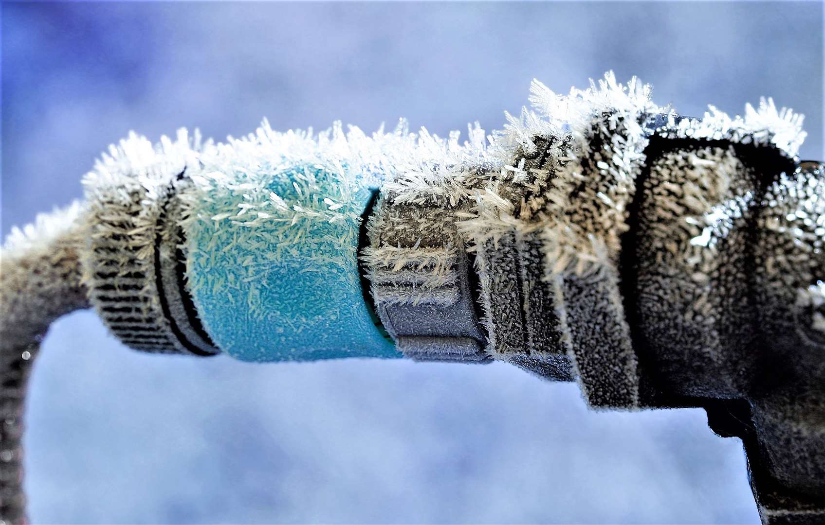 Frozen garden hose and water pipe connection.