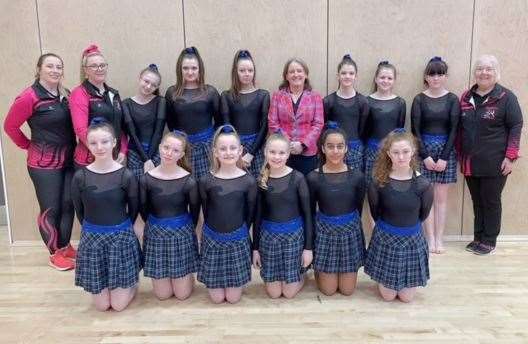 The rhythmic gymnasts and coaches with local MSP Maree Todd.