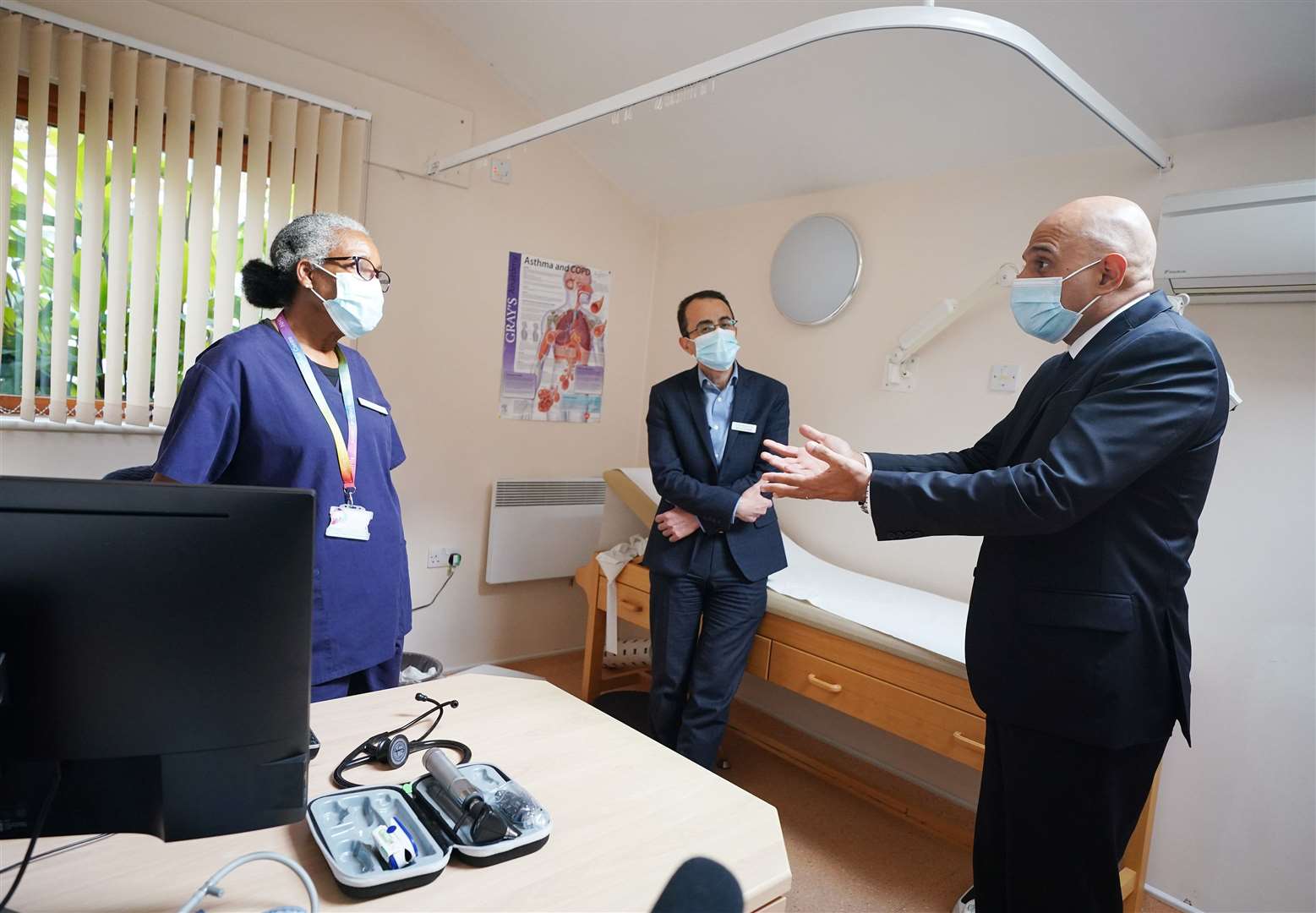 Health Secretary Sajid Javid meeting Dr Clementine Olenga-Disashi (left) and Dr Ali al-Bassam, during a visit to the Vale Medical Centre in Forest Hill, south-east London (Yui Mok/PA)
