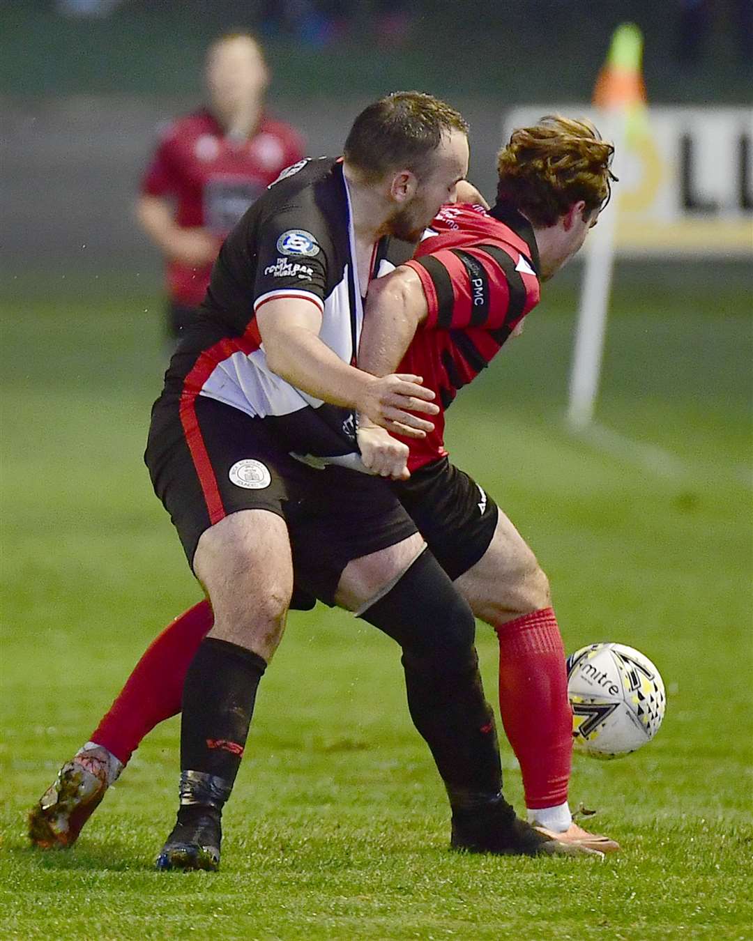 Inverurie's Myles Gaffney gets to grips with Wick defender Own Harrold. Picture: Mel Roger