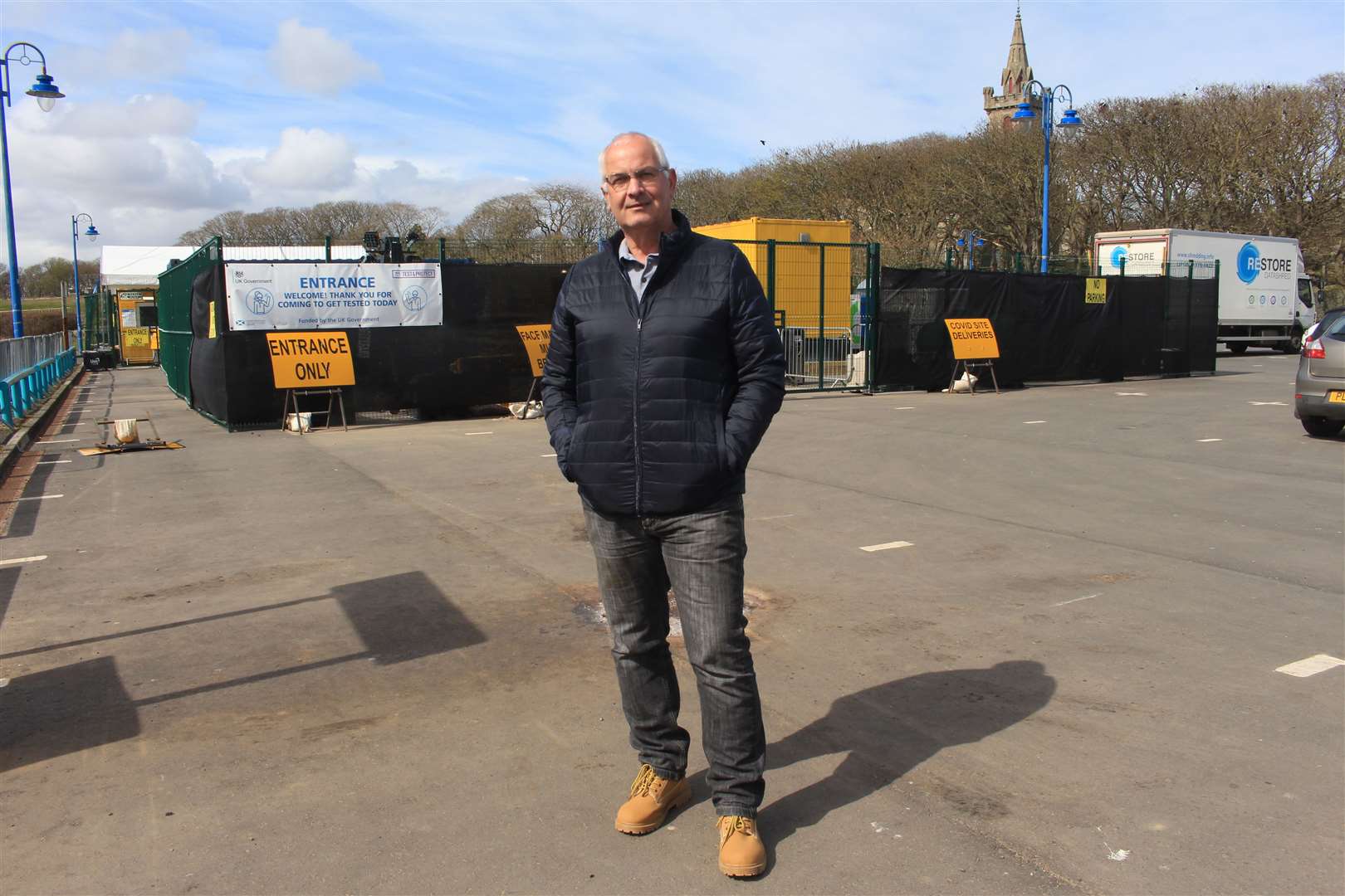 Councillor Raymond Bremner outside the Covid-19 testing centre at Wick riverside. The centre is taking up 12 parking bays intended for campervans and motorhomes. Picture: Alan Hendry
