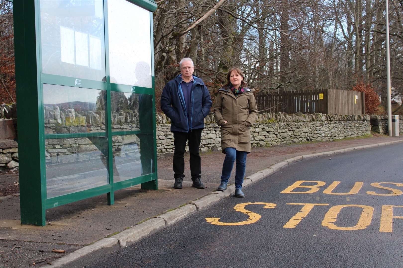 Maree Todd with SNP councillor Ian Cockburn at a bus stop in Contin. The picture was taken prior to the pandemic.