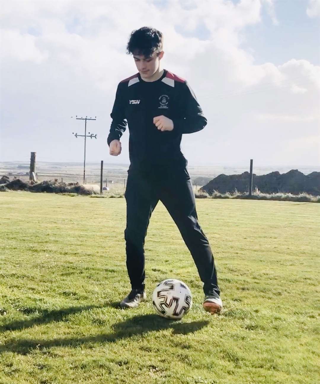Euan Kennedy doing a tick-tock drill, keeping the ball under control while passing it between left foot and right foot.