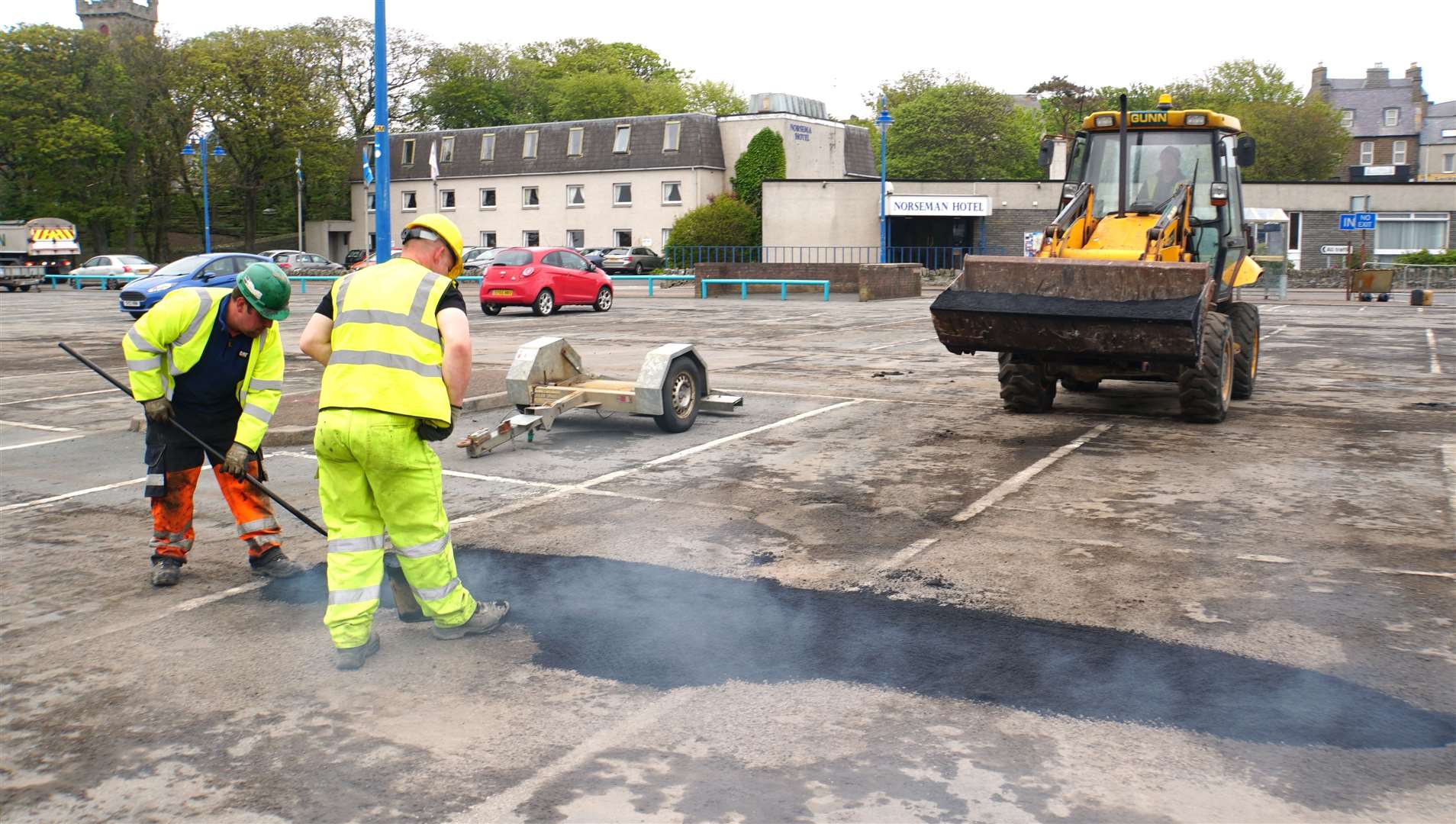 Contractors working on the badly potholed Wick riverside car park on Monday. Pictures: DGS