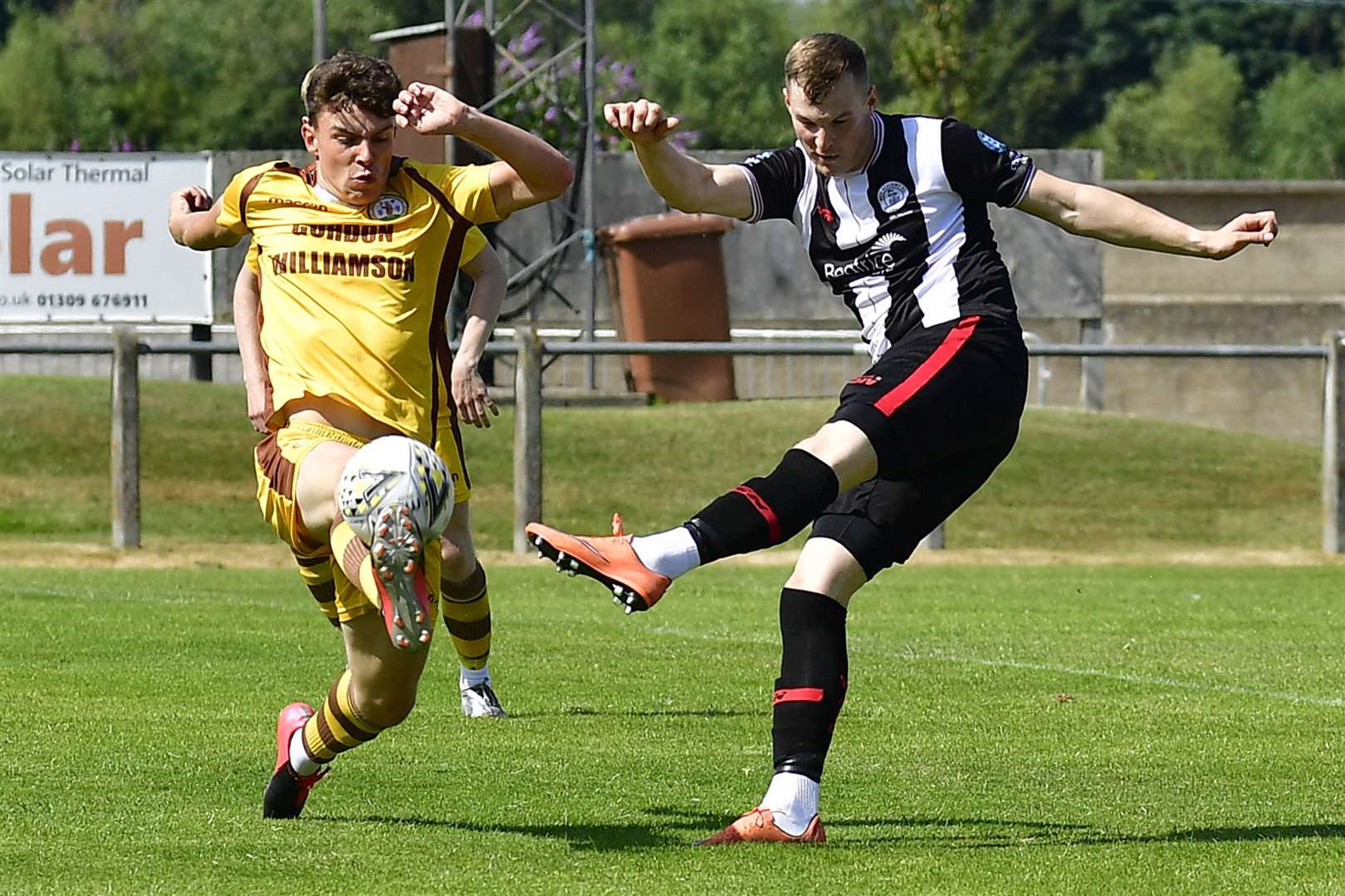 Forres Mechanics' Ruari Fraser attempts to block a shot from Wick Academy's Steven Anderson during the 1-1 draw at Mosset Park on the opening day of the 2021/22 Highland League season. Picture: Mel Roger