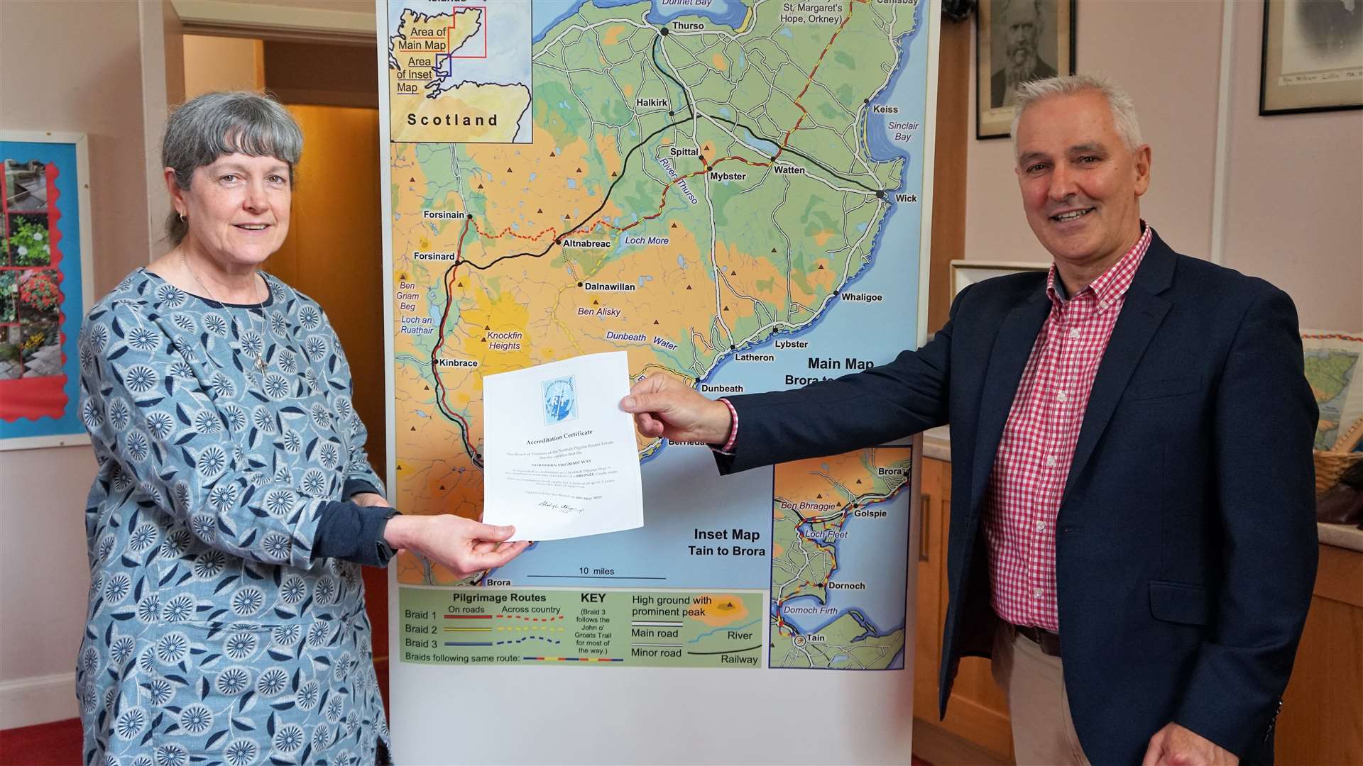 Trustee of the Scottish Pilgrim Routes Forum Fiona Mitchell hands the certificate to Cllr Karl Rosie who is chairman of the Northern Pilgrims Way. Picture: DGS