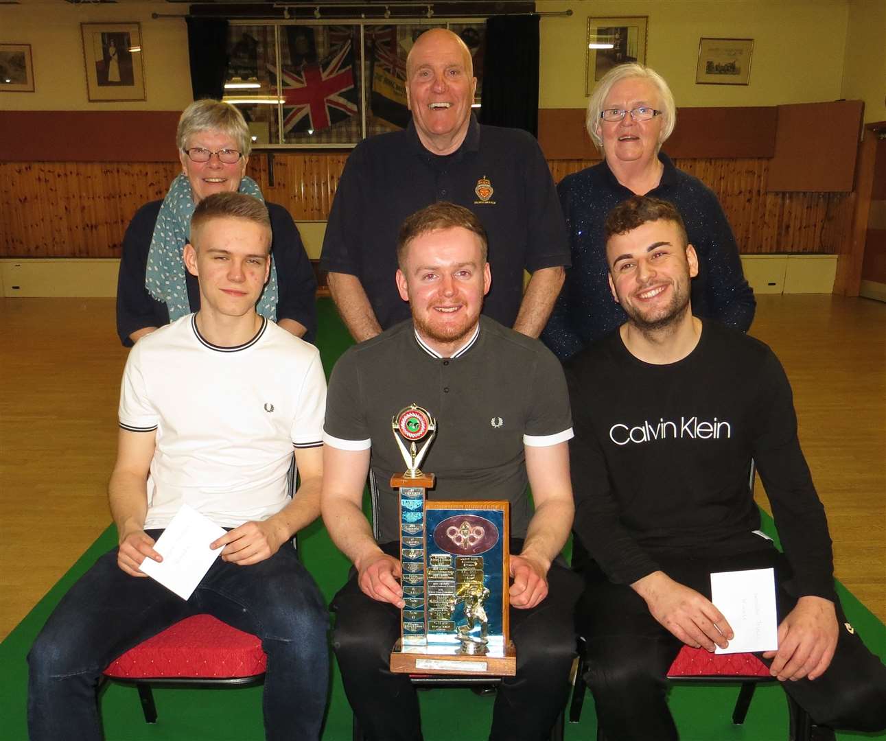 Winners (front, from left) Liam Mackay, Ross Cowan and Ian Mackay, with runners-up Cath Irons, Jimmy Campbell and Esther Campbell.
