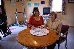‘See me’ campaign director Suzie Vestri and CHIF chair Pauline Craw signing the pledge.