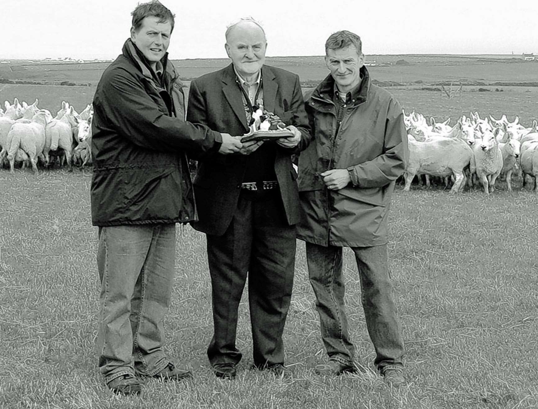 At the Mey Sheepdog Trials in 2006 Robert Banks received a presentation from chairman Alec Webster and secretary Dennis Simpson to mark his 60 years’ unbroken service as a committee member.