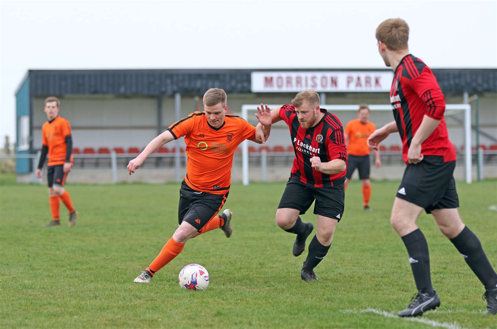 Gordie Swanson of John O'Groats battles with Halkirk's Mark Mackay in the Colin Macleod Memorial Cup. John O'Groats won 1-0. Picture: James Gunn