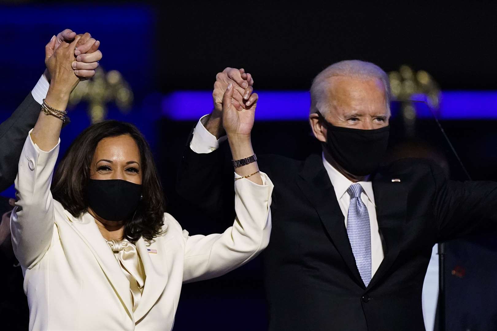Vice President-elect Kamala Harris holds hands with President-elect Joe Biden (Andrew Harnik/AP)