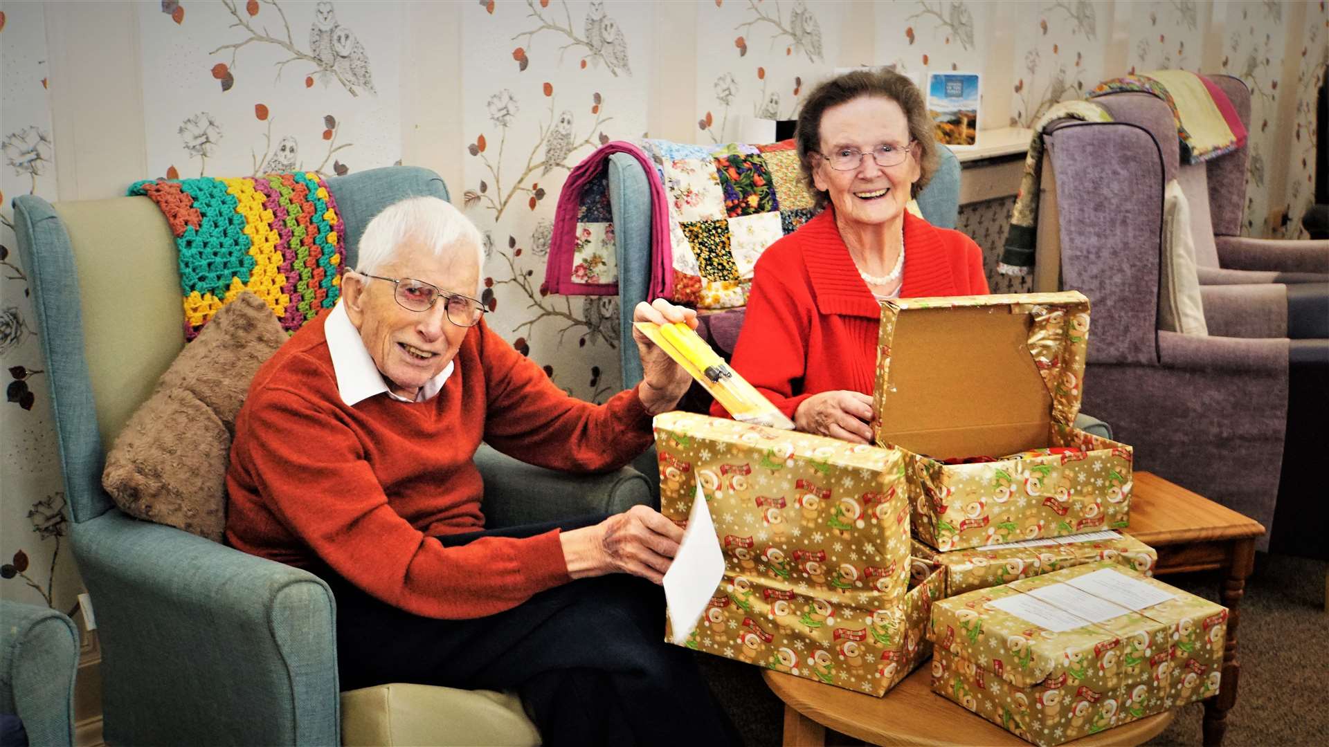 Riverside House care home residents Bill Backhouse and Margaret Mackenzie with the charity boxes they filled. Picture: DGS