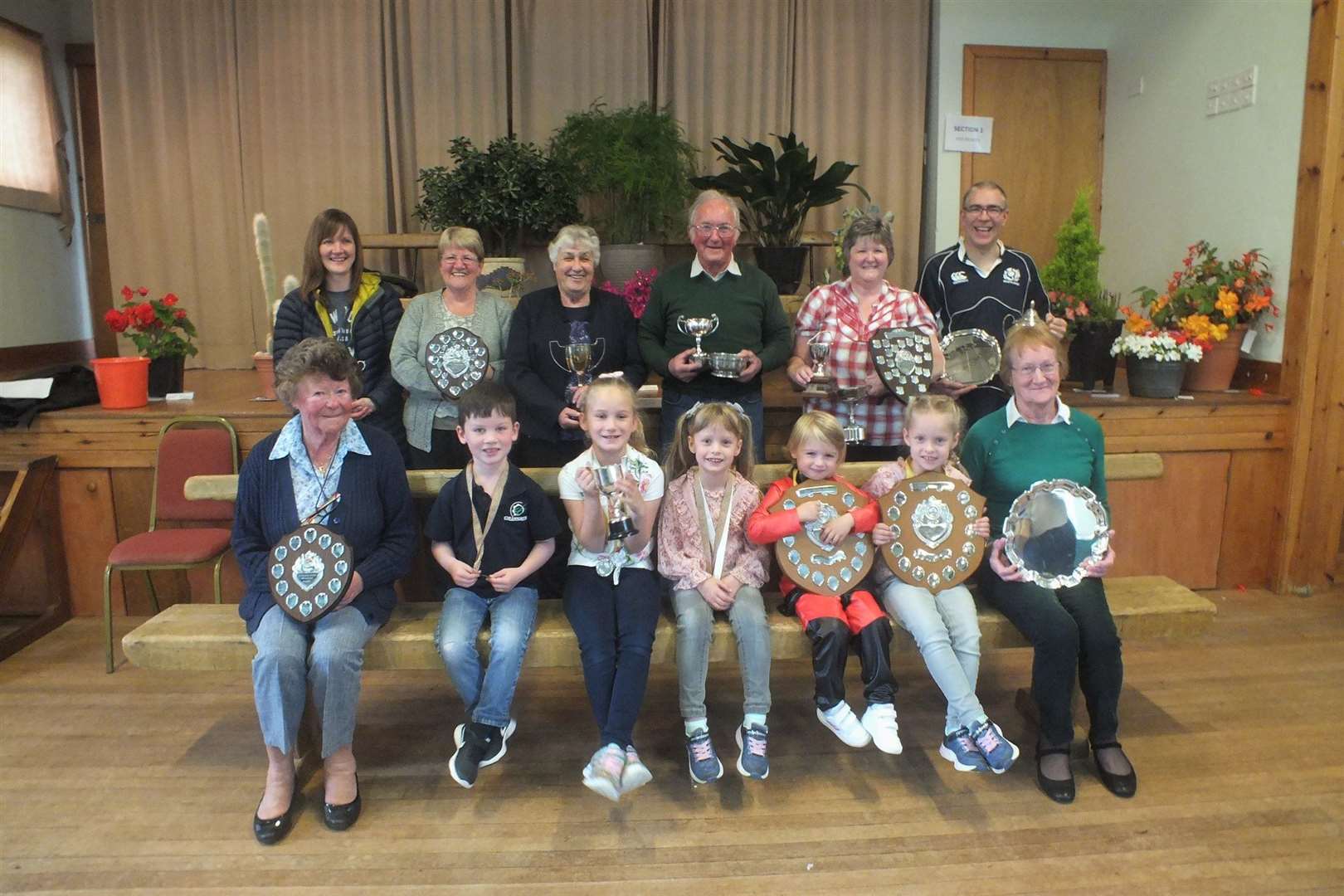 Prize-winners at Reay and District Garden Club’s annual horticultural show. Back row (from left): Heather Campbell, Amy Walker, Cathy Stewart, Donald Manson, Evelyn Mowat, Liam Bain. Front row: Annie Mackay, Harry Fulton, Emma Sutherland, Lauryn Sutherland, Lauren Tunn, Sophie Sutherland, Christine Steven.