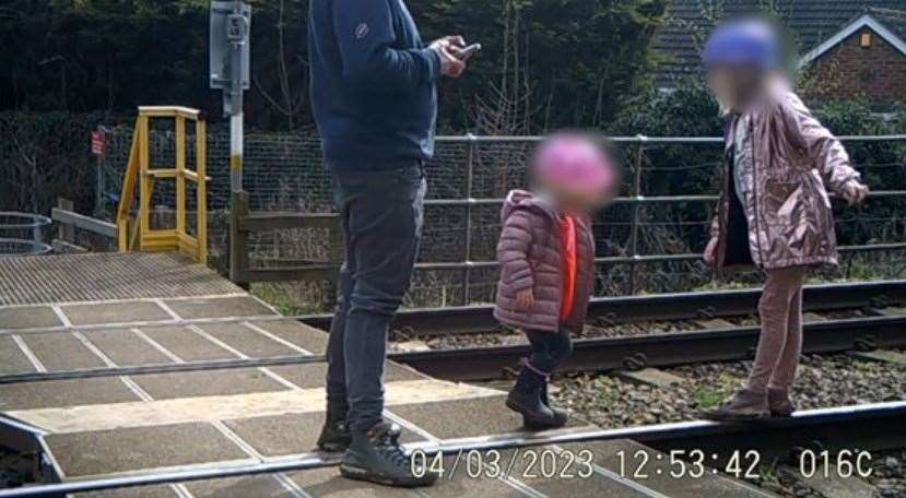 Two young girls with a man were seen playing on the tracks for over a minute and a half (Network Rail/PA)