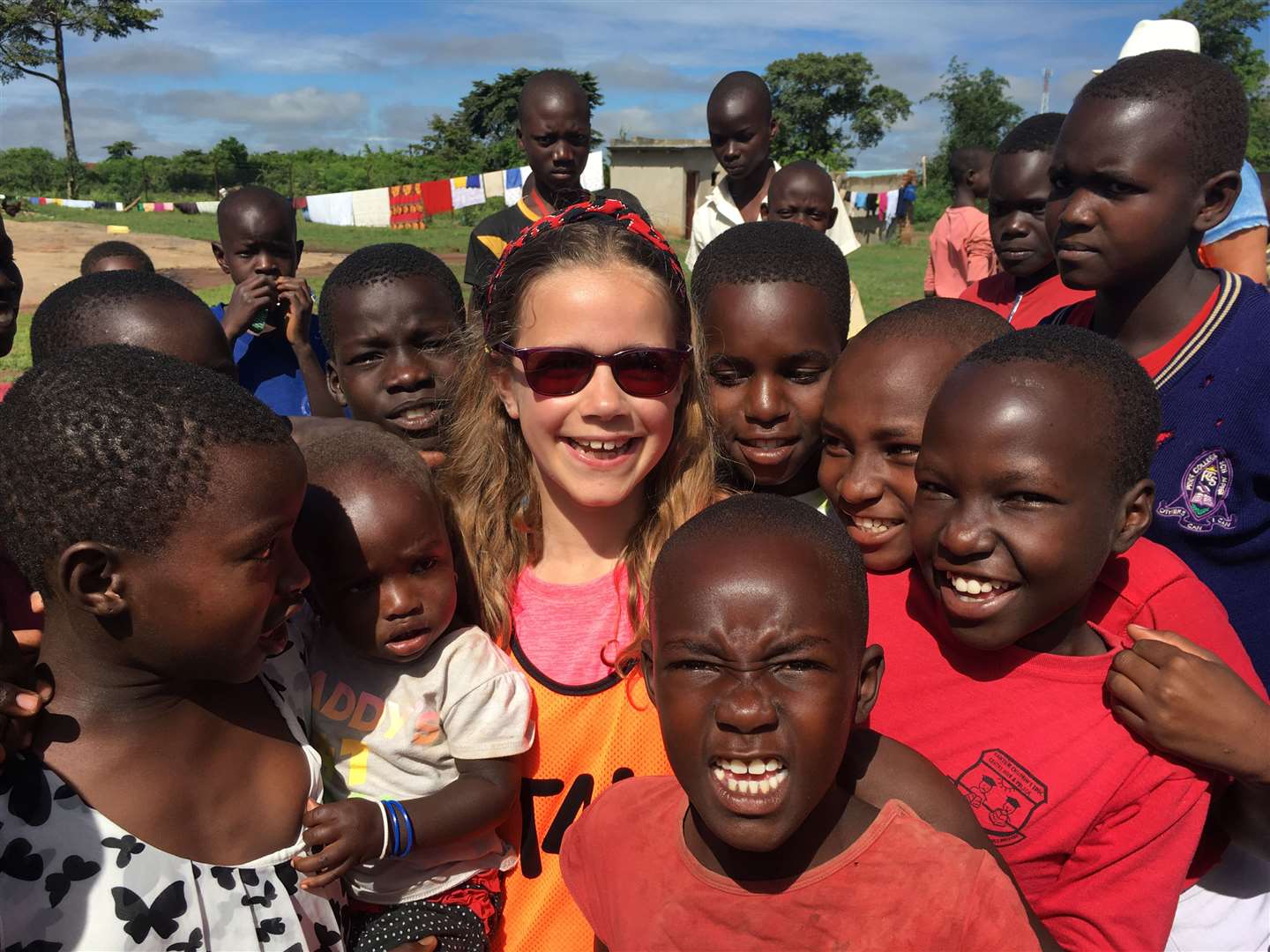 Nia surrounded by some of the Ugandan youngsters.