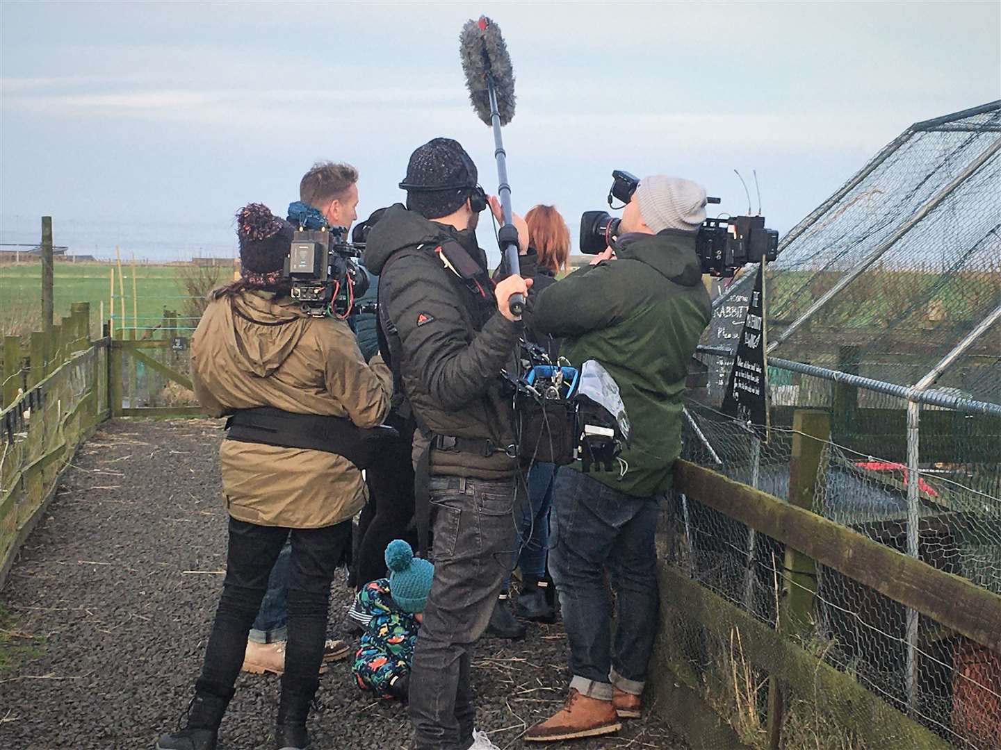 The camera crew surround Ben and Cara as a scene is shot at Puffin Croft in John O'Groats.