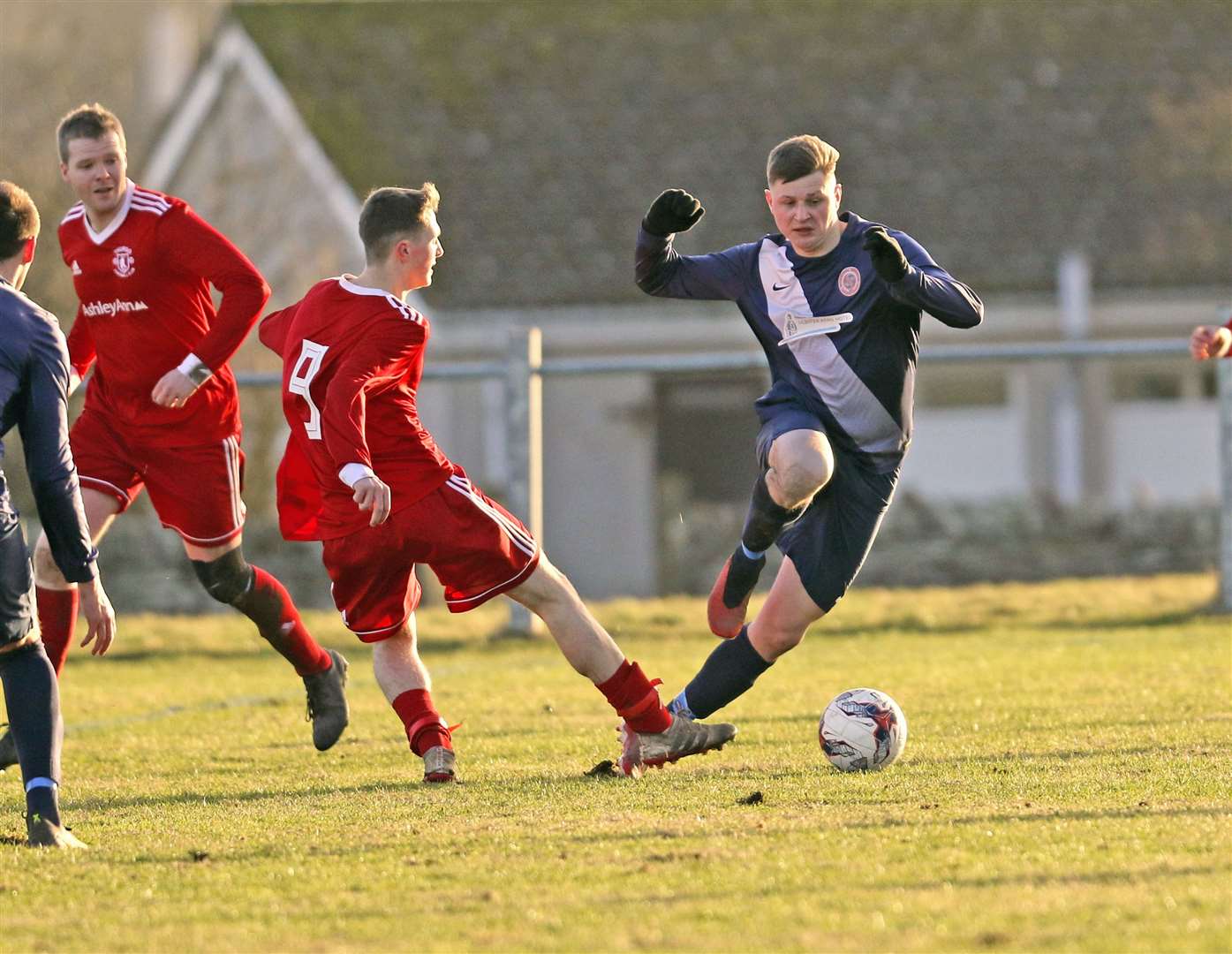 Kuba Koziol (right) gets past Thurso's Aaron Wilson during their last derby encounter. Halkirk boss, Ewan McElroy, hopes to have Koziol back from injury for this week's clash against the Vikings. Picture: James Gunn