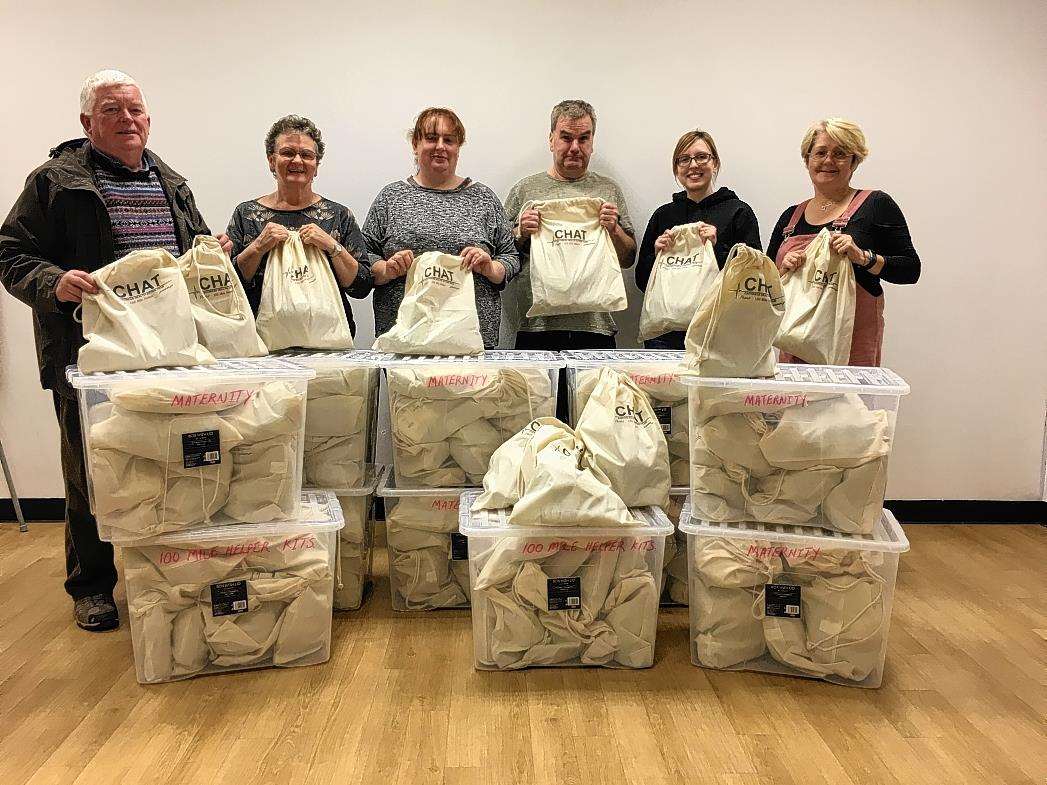 Members of Caithness Health Action Team prepare to dispatch some of the 100 mile helper kits.