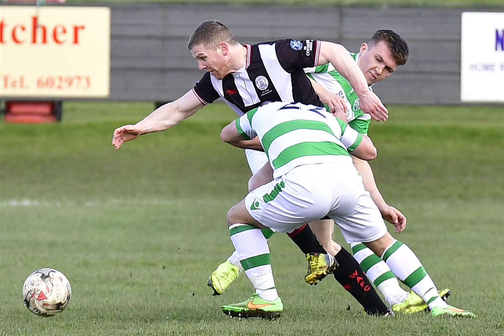 Wick Academy's Davie Allan goes past Buckie's Andrew Skinner and Callum Murray during a 2-0 win for the Scorries at Harmsworth Park in March 2019. The clubs' managers have contrasting views on the idea of switching to a summer season. Picture: Mel Roger
