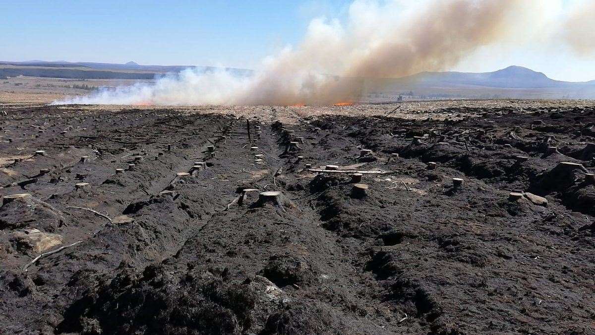 The ground near Melvich smoulders following the devastation of the recent wildfire. Picture: Thurso Fire Service