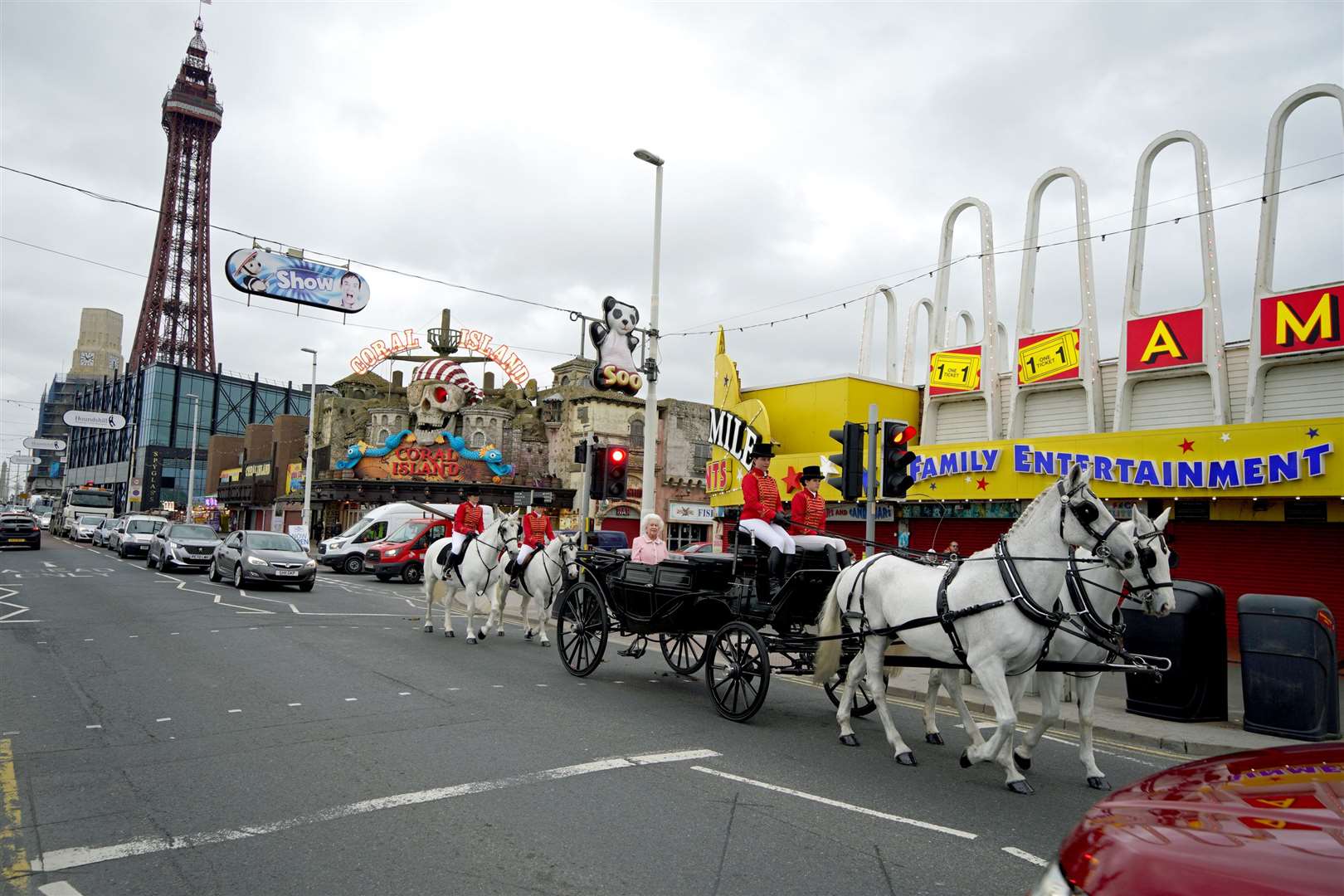 The wax figure of the Queen is driven along Blackpool’s seafront in a horse-drawn carriage (Peter Byrne/PA)