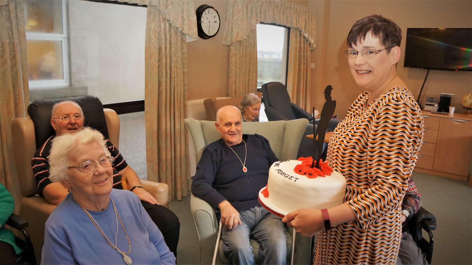 Anne Campbell with the cake she handed over to the residents of Pulteney House on Armistice Day.