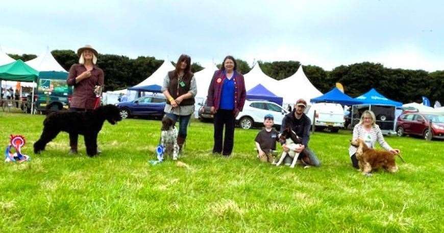 From left, Best in Show and Best Puppy in Show - Tracey Boyd and her 8 month old Russian Black Terrier; Reserve Best in Show - Christine Lord and her German Shorthaired Pointer; judge Laura Swanson; Best Working Collie - Jack and Mark Wilson; Best Veteran in Show - Jennifer Cowie and her Cocker Spaniel. Picture supplied