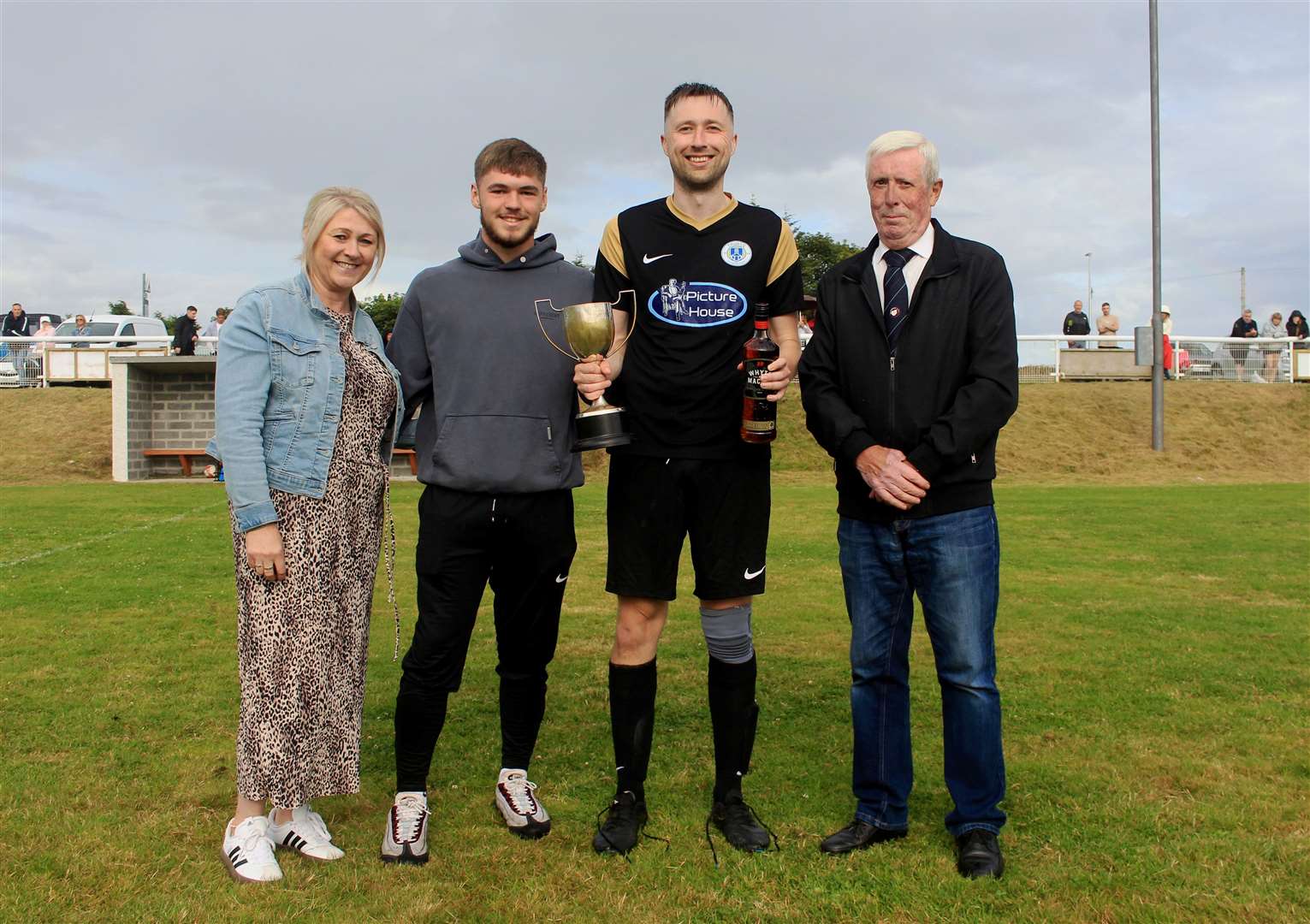 Captain Craig Trueman receiving the Steven Cup after Thurso Acks’ 4-3 extra-time victory over Keiss. The trophy was presented by Murdo Steven’s daughter, Amanda Steven, along with Amanda’s son Calum Barrowman, with Caithness AFA president Murray Coghill looking on. Picture: Alan Hendry