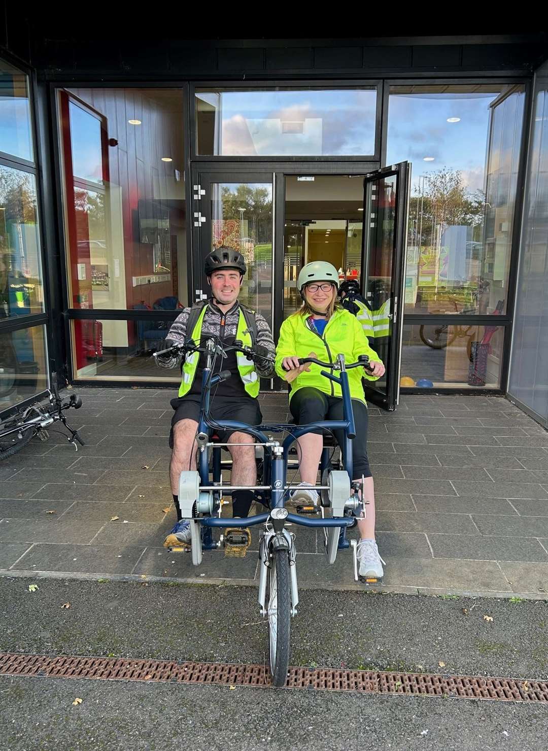 Head teacher Fraser Thomson and principal teacher Caroline Aitken trying the side-by-side tandem courtesy of Cycling UK.