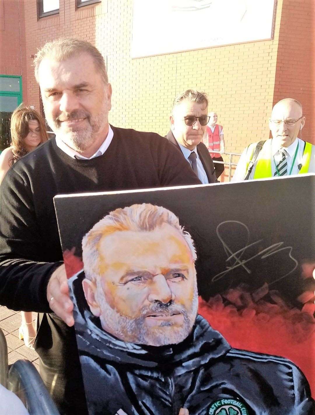 Celtic's manager Ange Postecoglou signed the painting by Davie Greig from Thurso.