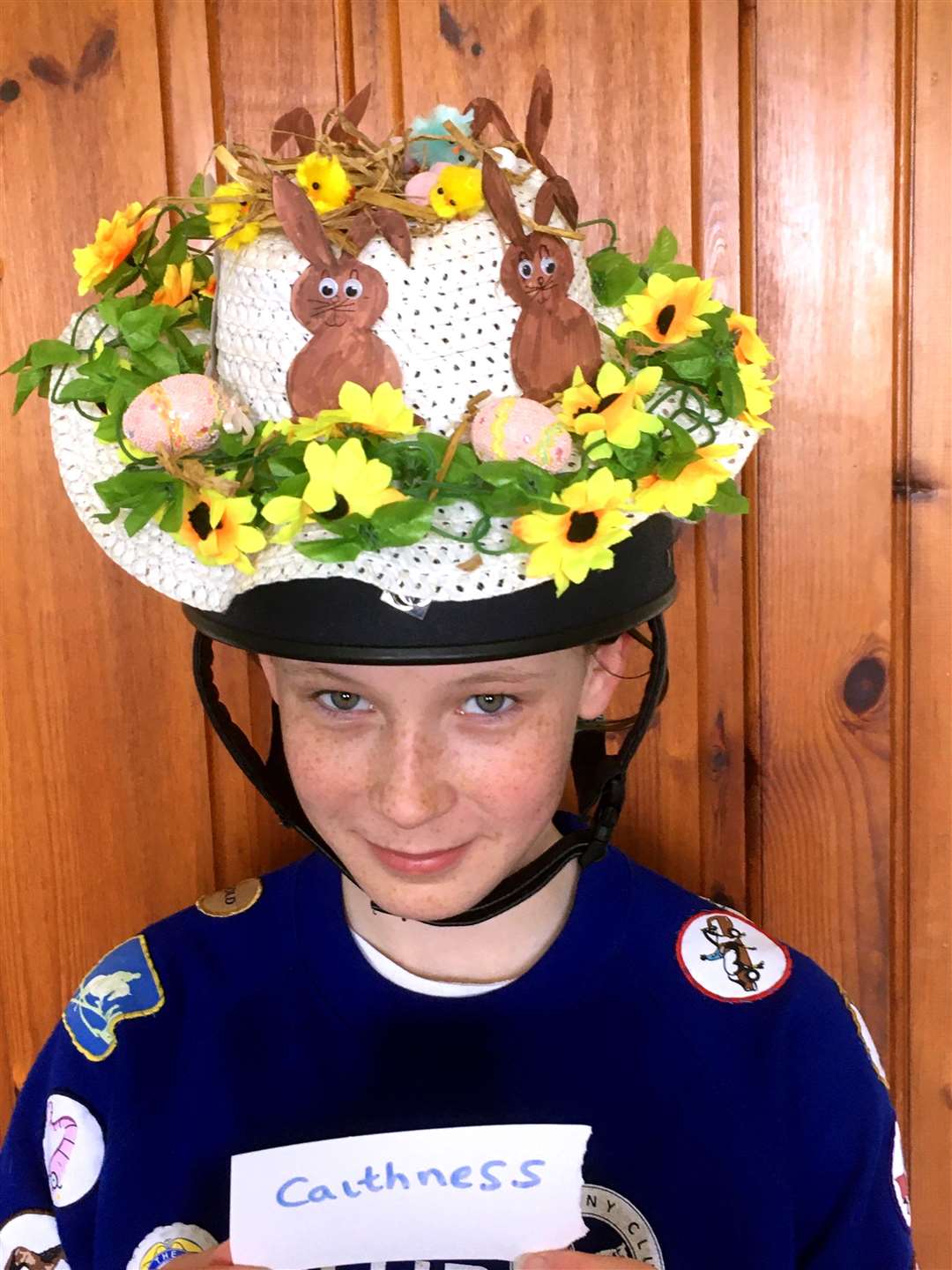 Erin Hewitson with her fabulous creation which helped earn first prize in the team Easter bonnet competition.