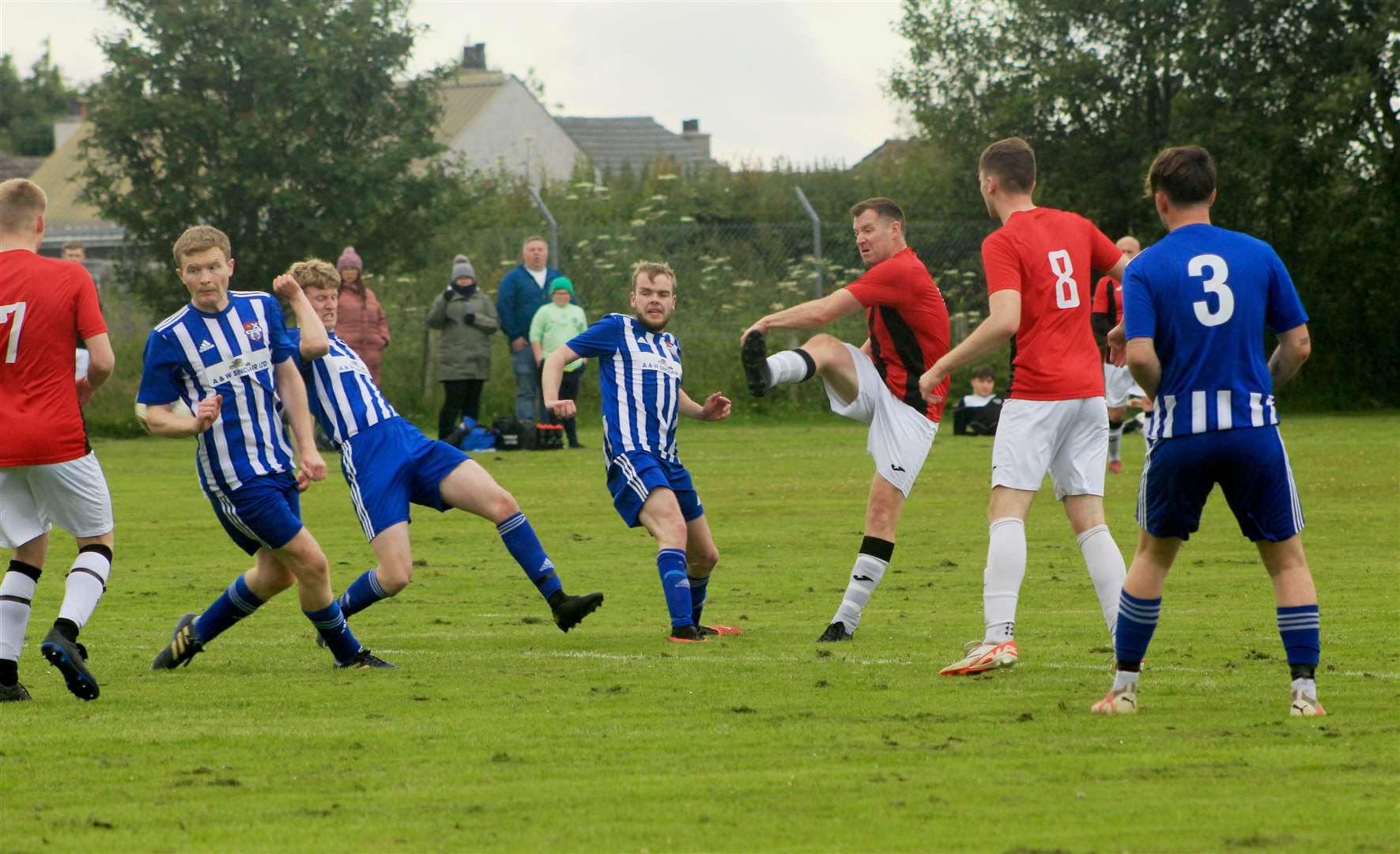 John McLean of Thurso Swifts tries a shot on goal during the first half at Watten on Tuesday night.