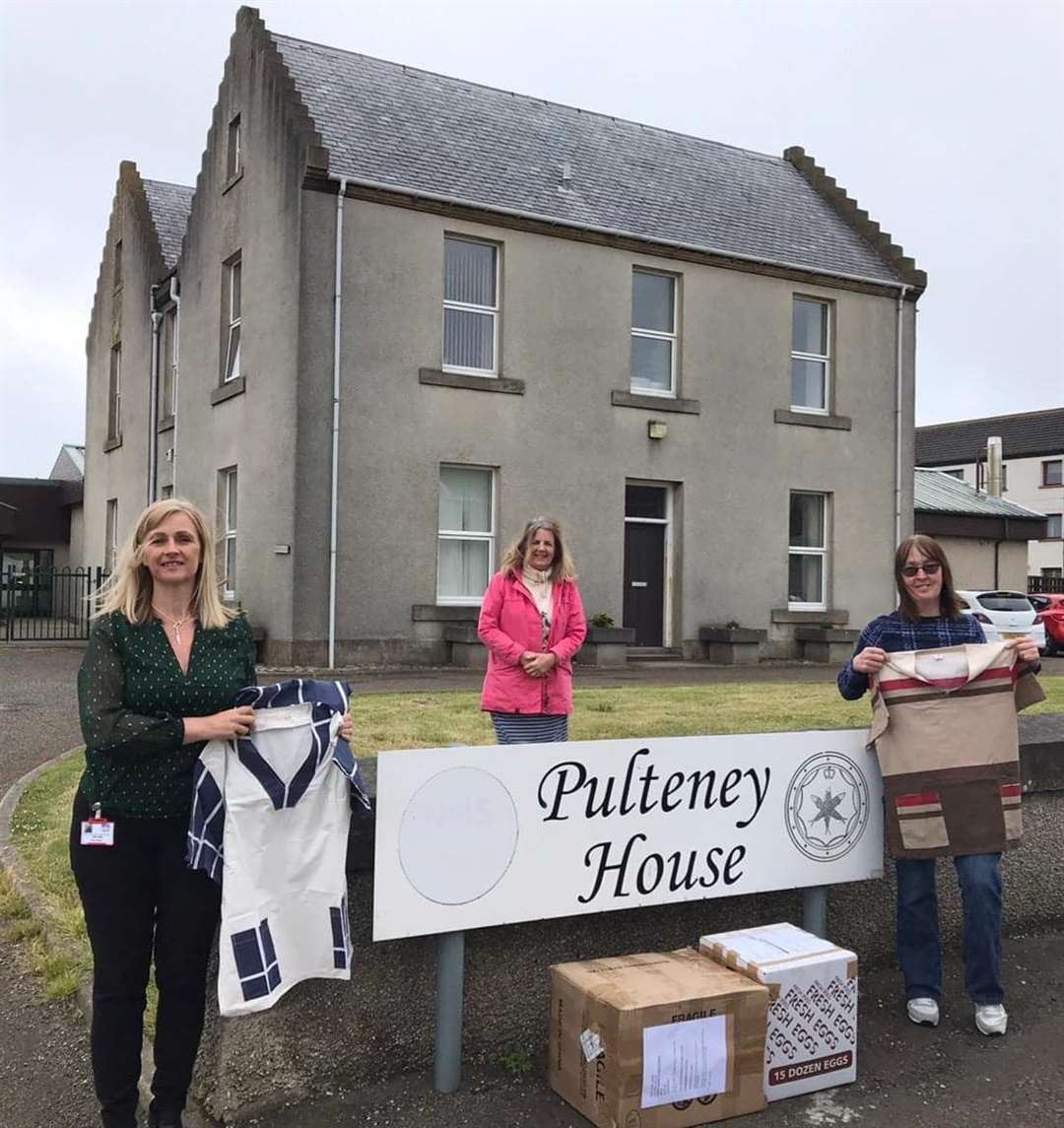 Safe arrival at Pulteney House care home in Wick, with deputy manager Julie Lewis (left), Susan Martens (centre) and deputy manager Liz Sinclair holding the scrubs.