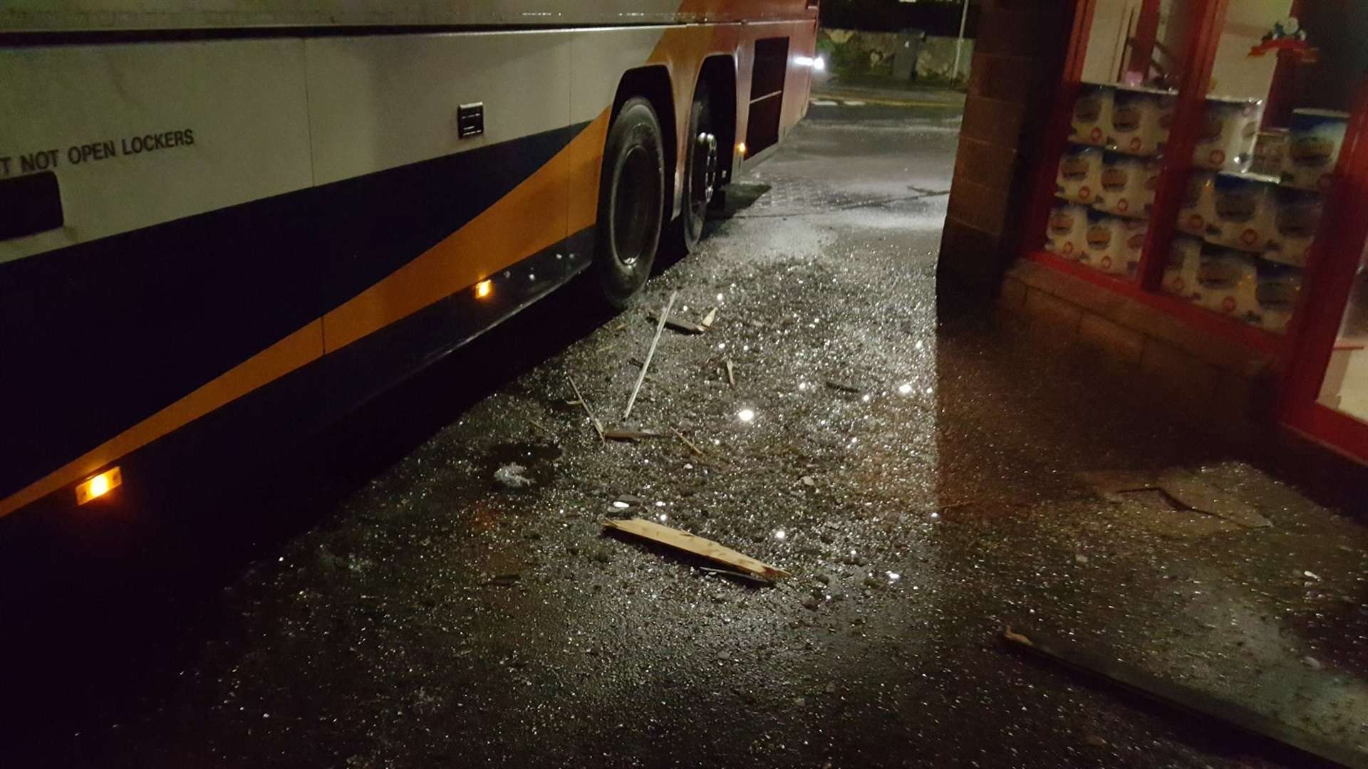 The icy pavement and damage done to the Poundstretcher store.