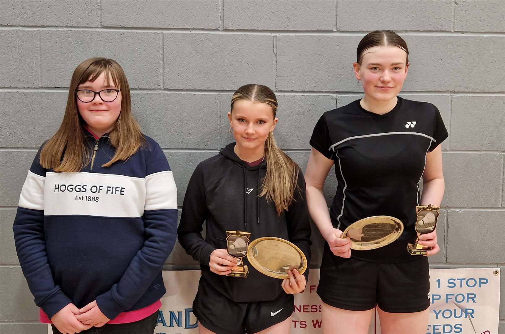 Girls' doubles winners Ava Cook (centre) and Chloe Mackenzie (right) with Lexie Mackenzie, who was representing Highland Workwear.