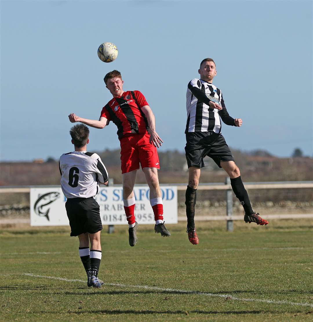 Aaron McNicol wins a header for Halkirk United during Saturday's clash with Alness United at Morrison Park. Picture: James Gunn