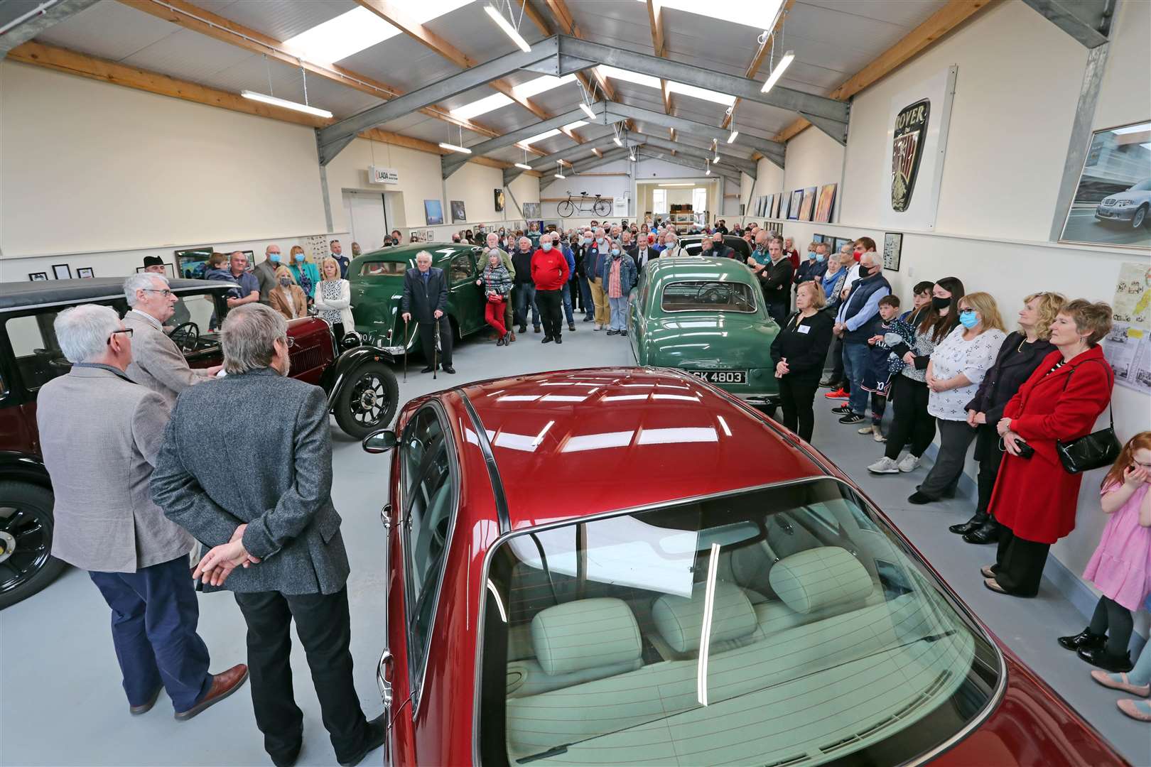 Guests and volunteers inside the Edward Sutherland Gallery on Saturday as Alasdair Sutherland gives his opening speech. Picture: James Gunn