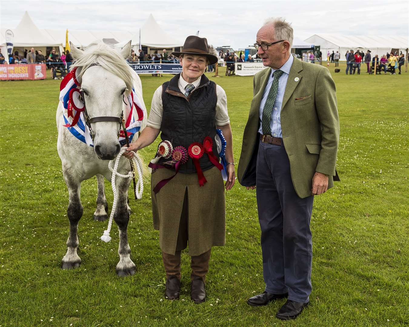 Last year's supreme champion at Sutherland was a grey Highland mare, Katrina Strathmore, shown by Shona Halford, standing next to judge David Leggatt.