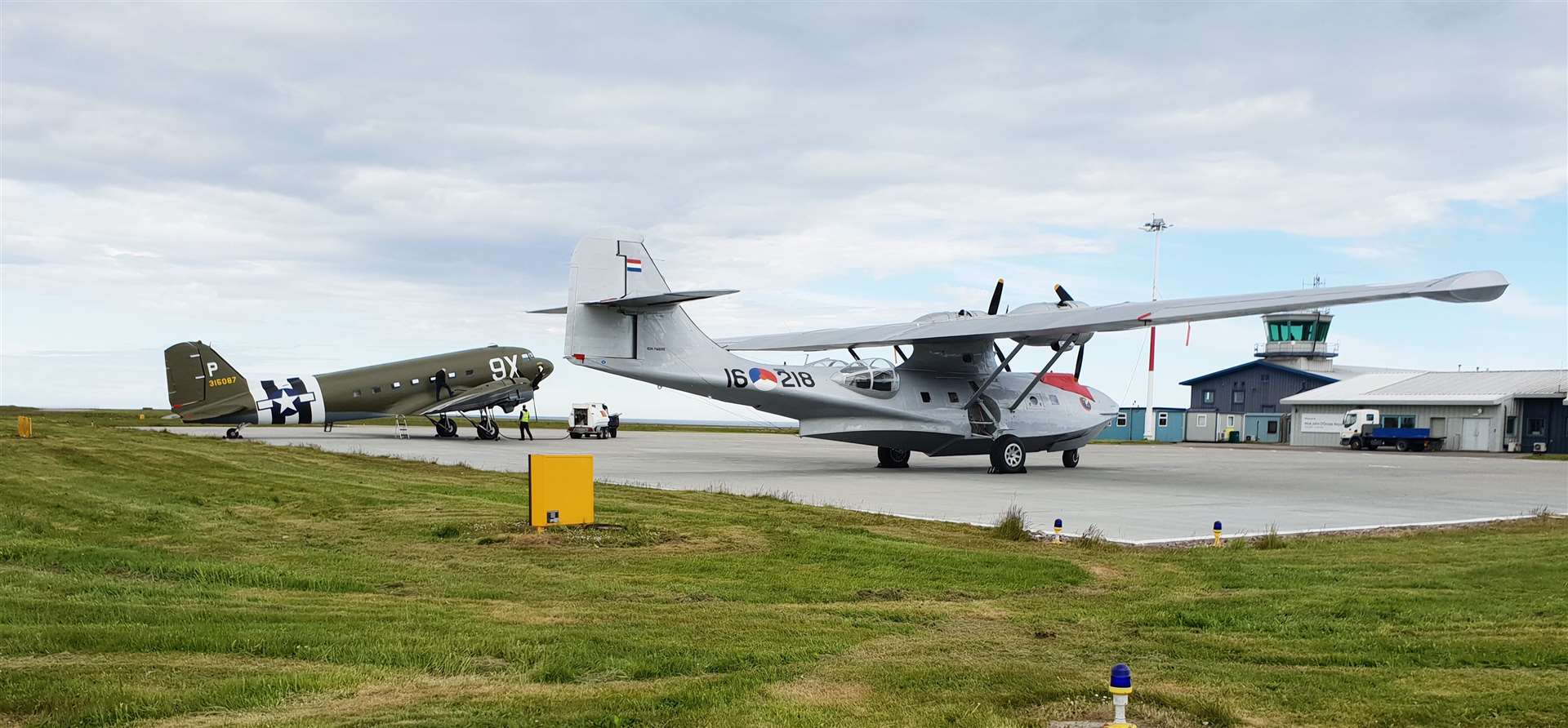 The Douglas DC-3 on the left alongside the Catalina at Wick John O’Groats Airport. Picture: Drew Murray / Far North Aviation