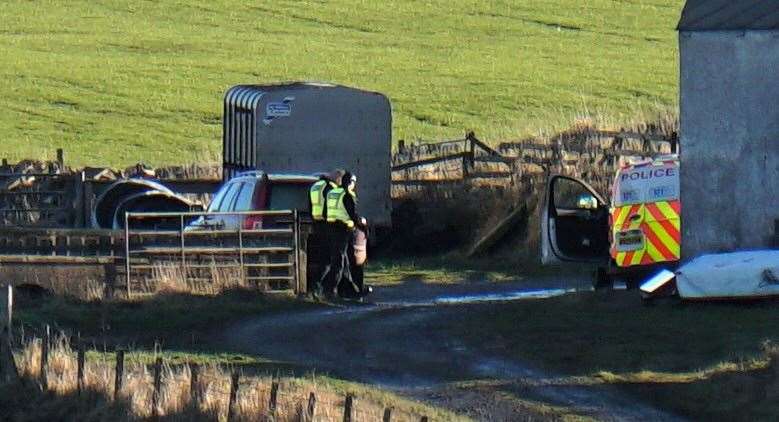Police have blocked off the road leading to the Barns of Hempriggs farm just south of Wick. Picture: DGS