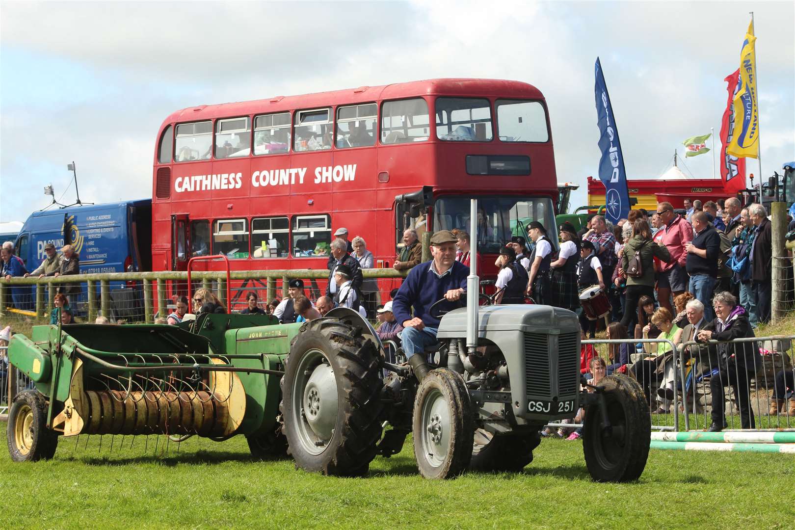 One of the vintage tractors passing the secretary's bus. Picture: Alan Hendry
