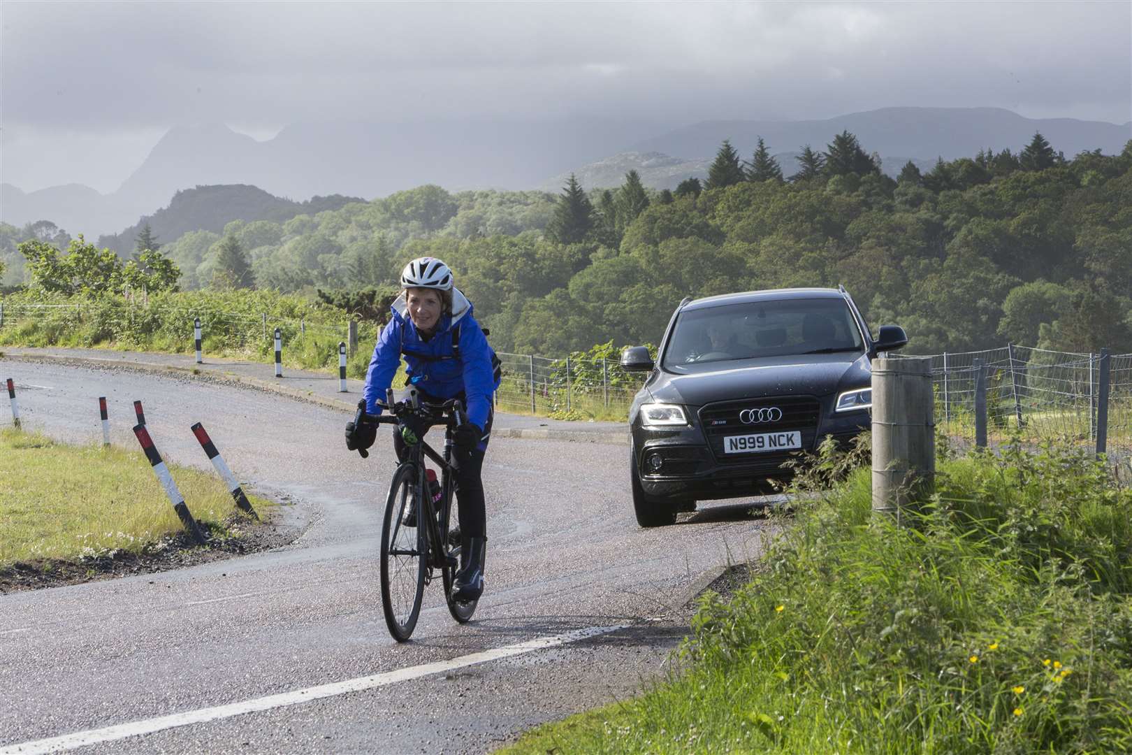 Lorna Stanger makes her way through Gairloch on the cycle stage of the event. Picture: Robert MacDonald/Northern Studios
