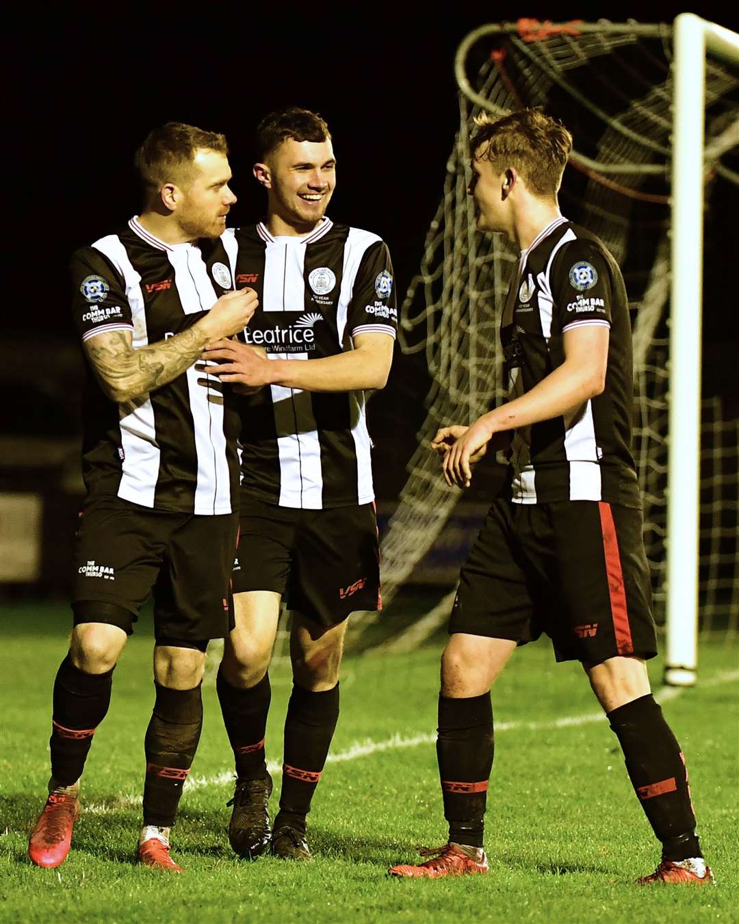 Substitutes Ben Sinclair and Mark Macadie celebrate with Craig Gunn after the striker's second penalty put Wick 2-1 up. Picture: Mel Roger
