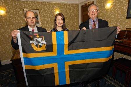 Presenting the Caithness flag are (from left) Caithness Ward Manager David Sutherland, Caithness Civic Leader Gail Ross and Lord Lyon Joseph Morrow. Photo: Robert MacDonald.