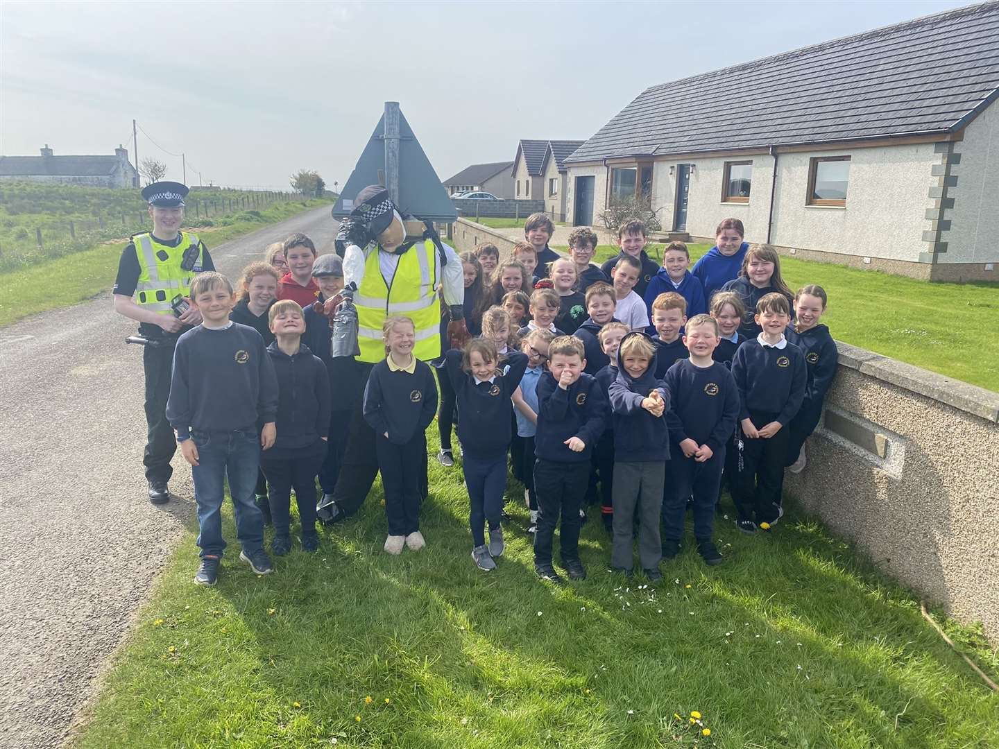 Police officer Matthew Thain with children from primary 1-7 at Thrumster.