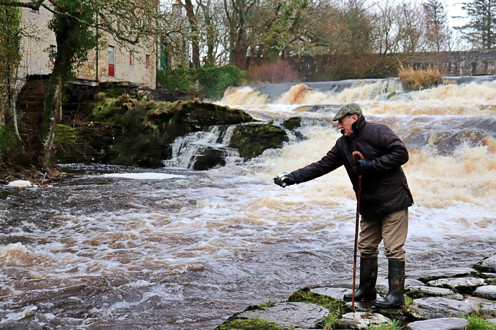 Rod owner and board member Mike Wycherly toasting the river with a dram from Wolfburn. Picture: Karin Miller