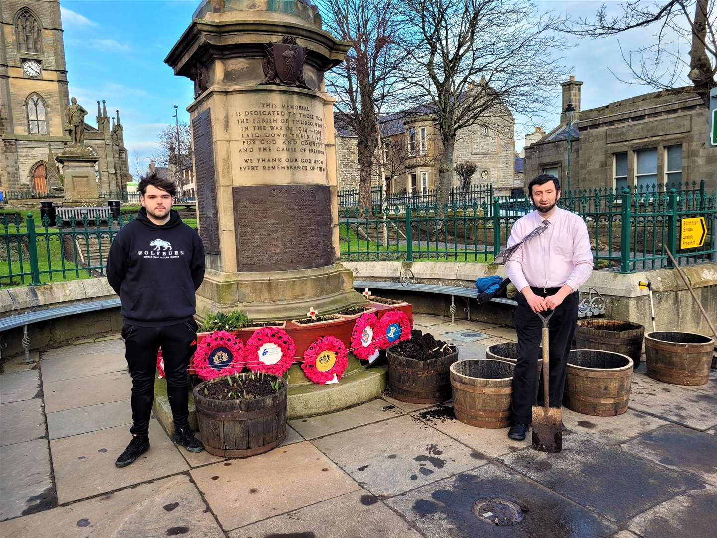 Alex Glasgow, at right, with Matthew from Wolfburn Distillery. The whisky company supplied the planter barrels situated at Thurso's war memorial. Picture supplied
